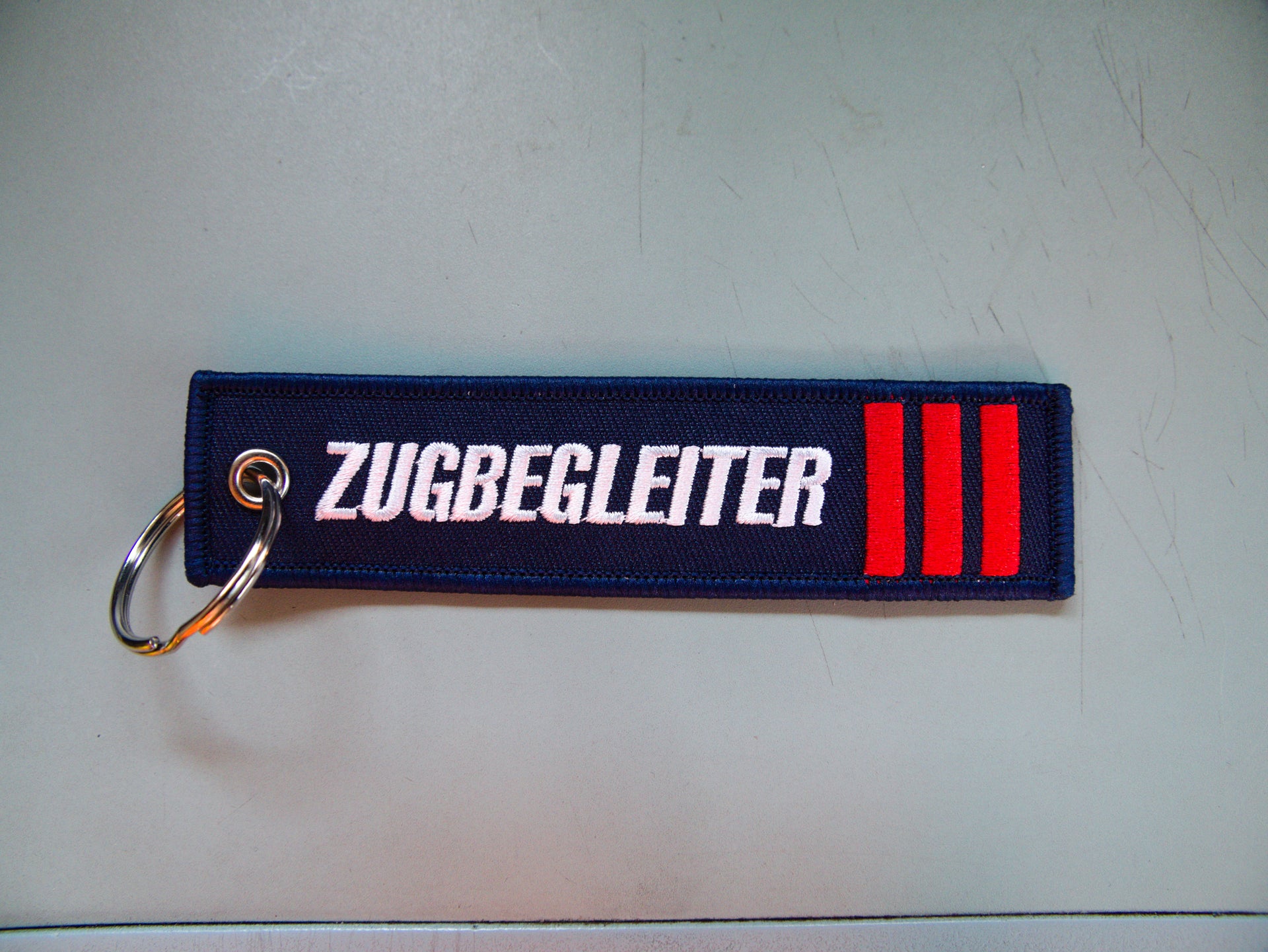 Schlüsselanhänger Zugbegleiter